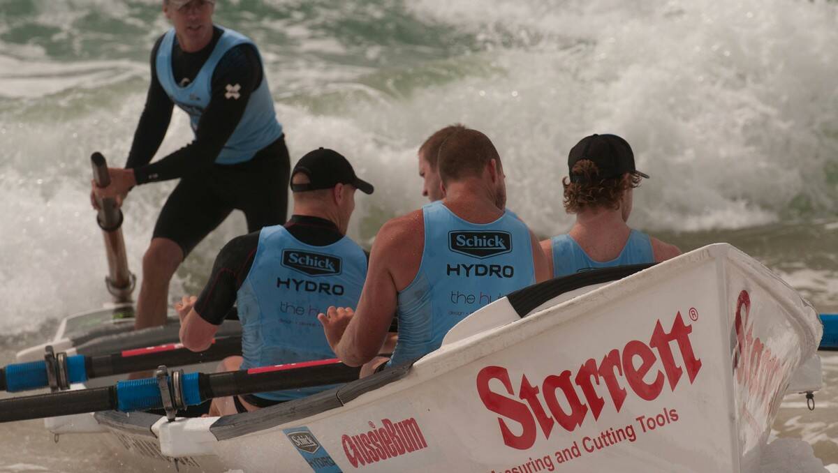 WAVE RUNNERS: Sweep-coach Neil Innes leads his Batemans Bay crew at Dee Why on Saturday.