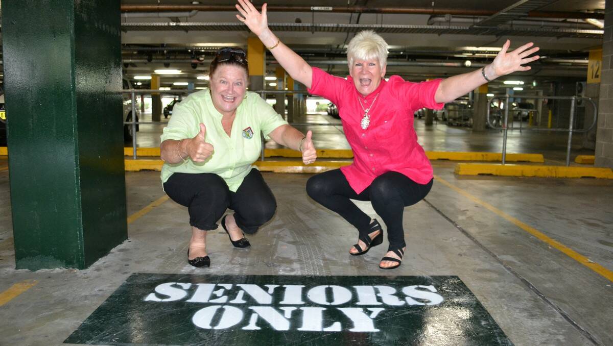 PRESS GANG: The Gossip Gals’ social calendar leaves no room for watching paint dry, but Dawn Simpson and Rosalyn Allen are thrilled with the new signs in Batemans Bay’s Village Centre car park.