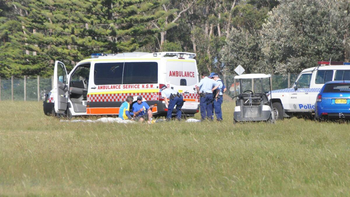 TRAGIC SCENE: Ambulance and police at the scene of the fatal skydiving accident at Moruya Airport yesterday.