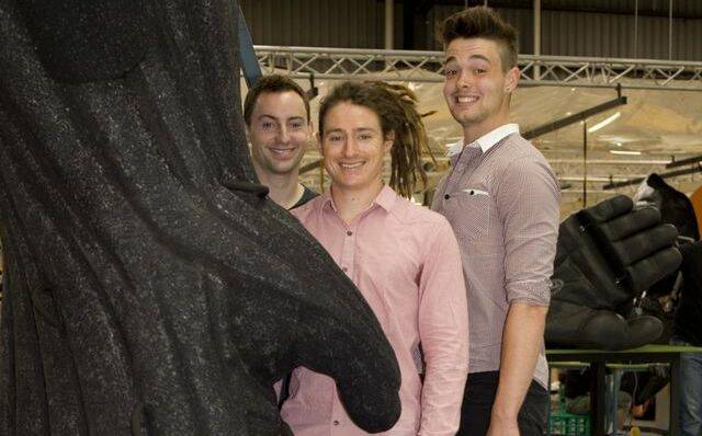 KONG SIZE: Former Batemans Bay boy Brett Franzi (right) with fellow National Institute of Circus Arts graduates and King Kong cast members Adam Davis and Tayo Wilson at Global Creatures West Melbourne workshop. Photo: PONCH HAWKE.