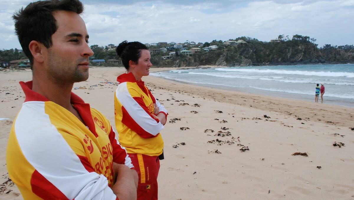 KEEPING WATCH: Lifeguard Services Australia’s Bernard Robben and Melanie Fitzgerald watch the beach after it was reopened on Friday afternoon.