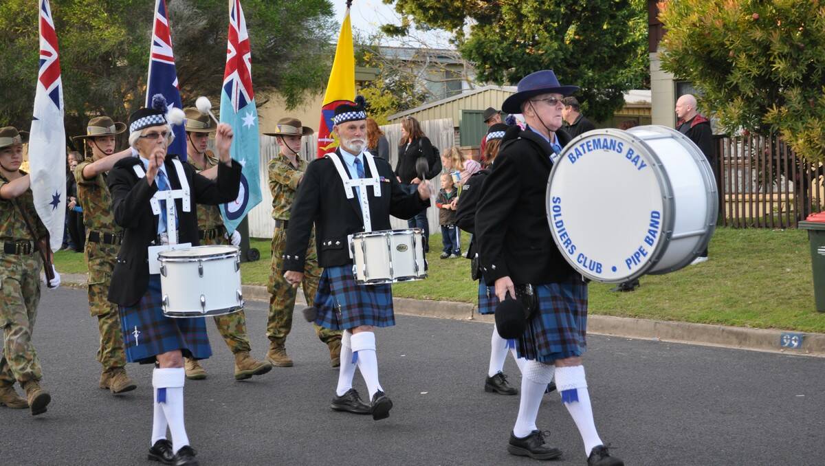 SACRED DAY: Cadets and Batemans Bay Soldiers Club band members march at Tomakin on Anzac Day last year.