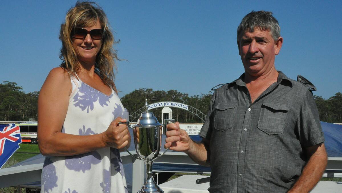 CUP DELIGHT: Michelle Ritchie (owner) and Paul Murray (trainer) pose for the cameras with their Narooma Cup trophy after taking out the $27,000 feature race with Fair Nation. PHOTO: Dean Benson.