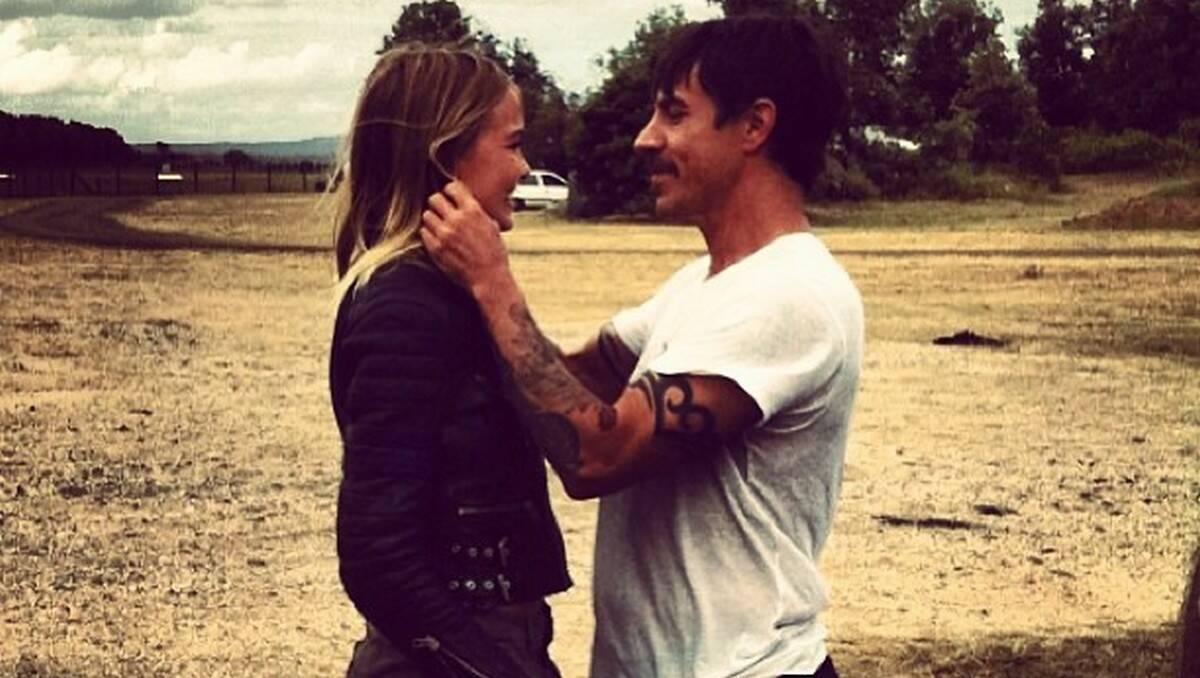 PUBLICITY POSE?: Lara Bingle posted this photograph of herself and Red Hot Chili Peppers lead singer Anthony Kiedis at Moruya Airport on social media sites this week.