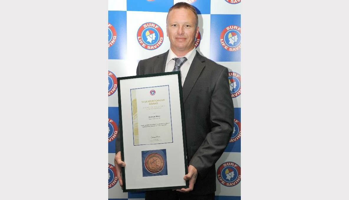 Andrew Mizzi from Broulee Surfers Surf Life Saving Club with his meritorious award for the rescue of a drowning man in December last year.