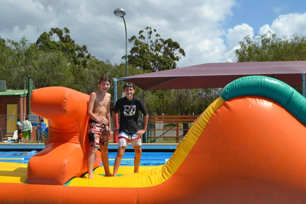Kids were entertained with a blow up inflatable toy while parents swam in the YMCA Swimathon at Batemans Bay Pool on Sunday