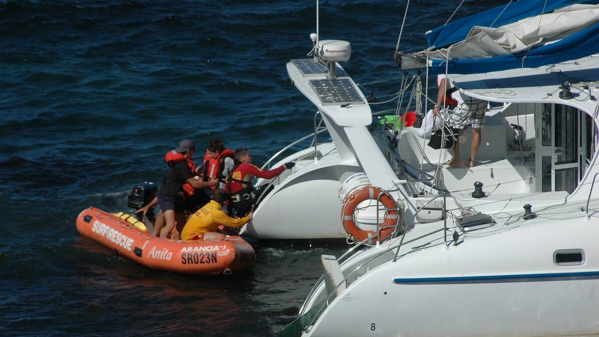 Eight people were rescued from a stranded catamaran at Caseys Beach on Monday afternoon.