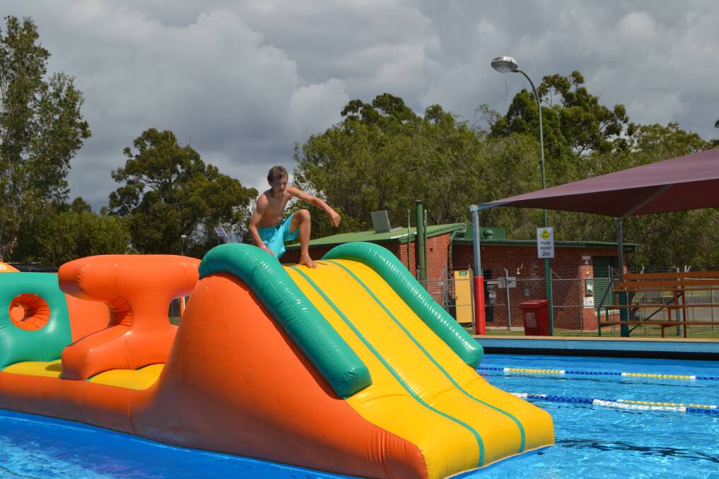 Kids were entertained with a blow up inflatable toy while parents swam in the YMCA Swimathon at Batemans Bay Pool on Sunday