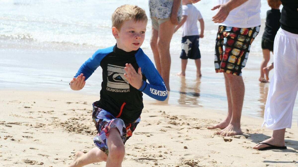 ULLADULLA: Thomas James on the fly during the Sandgropers and Nippers competition on Mollymook Beach on Saturday morning.