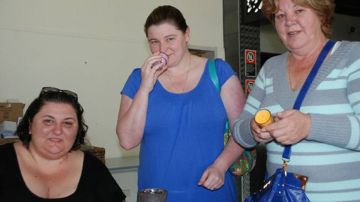 COOMA: Melanie Caffarelli and Debbie Cowling enjoyed the fragrance of the soy candles on offer from Cynthia Grozdanovsski at the Cooma Wellbeing Expo, which celebrated healthy   bodies and healthy minds.