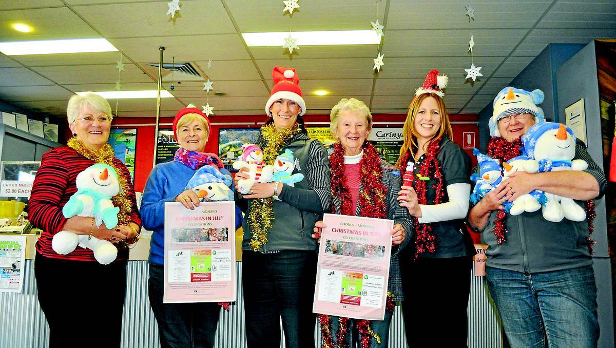 COOMA: Getting into the Christmas spirit are Marilynne Weston and Jan Carpenter from the Cooma Hospital Auxiliary with Kirsten Jackson from the Visitors Centre, Robin Fletcher from the Hospital Auxiliary, Visitors Centre manager Donna Smith and Frances Redden from the Visitors Centre.