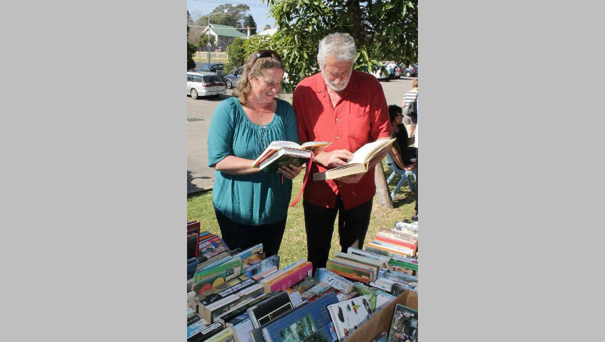 Claire Burgess and Rob Jamieson check out the book stall at Bega High School today.