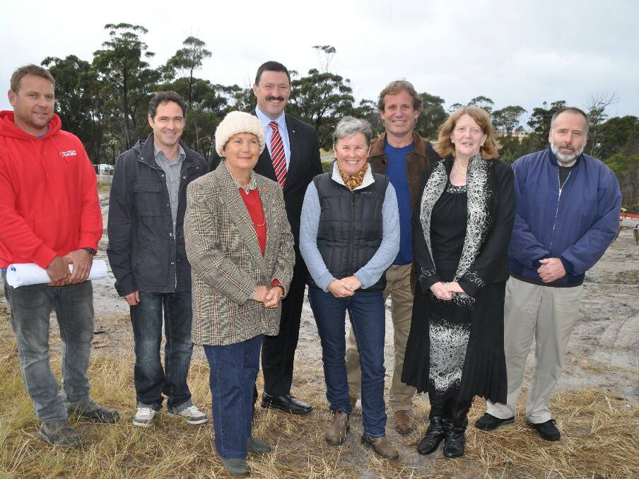 Builder, Mick Collins, left, architect, Ashley Foote, parent Carol Russell, member for Eden-Monaro Dr Mike Kelly, parent Katrina Ewing, project manager Chris Bird, WorkAbility senior manager Leony Power and parent Ron Russell on the site of the new accommodation  at Tura beach for local disabled adults to live independently. 