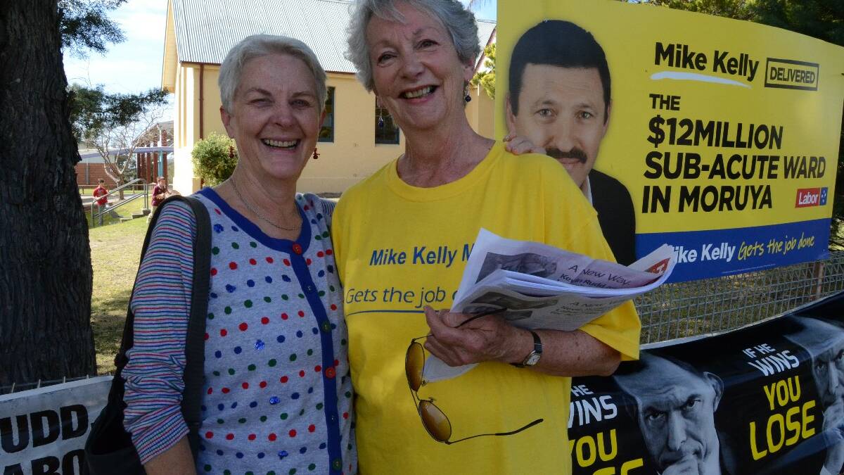 Friends Penny Cook and Olgamary Savage, who is president of the ALP Moruya branch, caught up at the polling booth on Saturday.