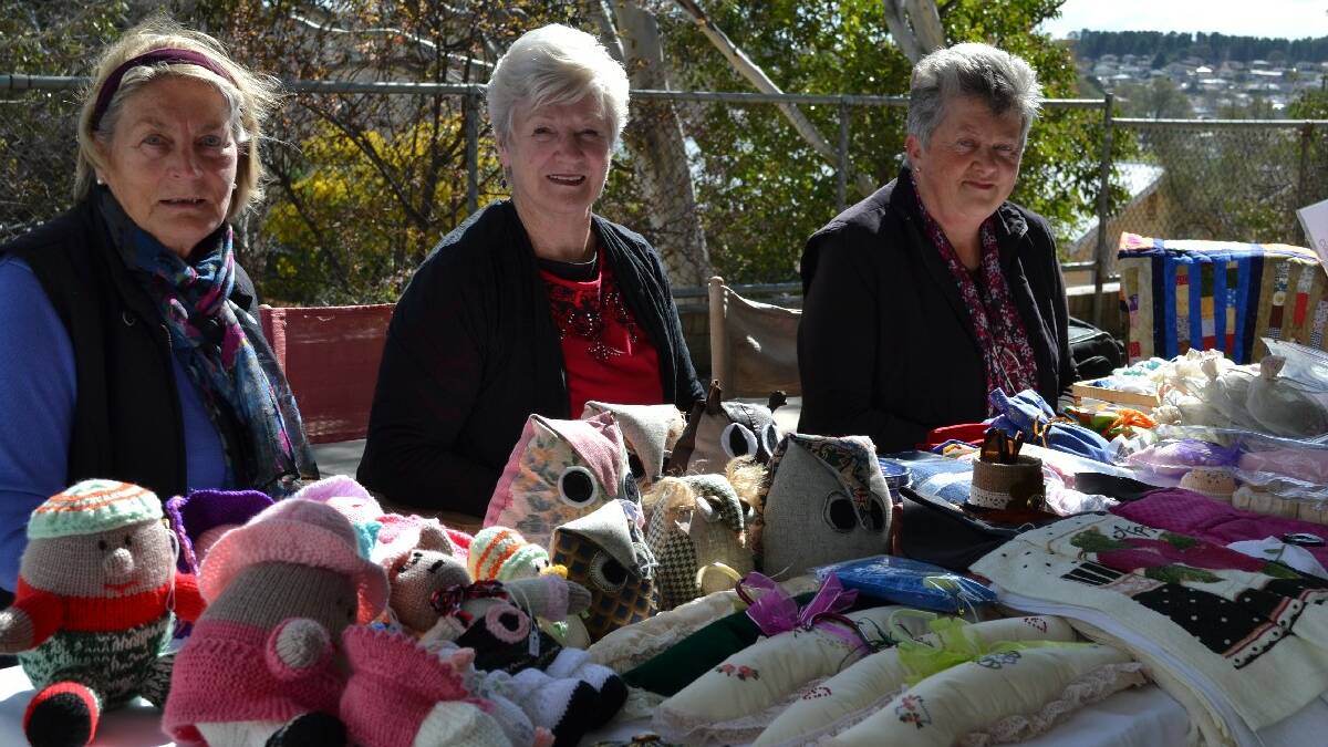 Members of the Cooma Craft Group positioned themselves at the entrance of the Cooma Public School polling station to sell their wares and raise funds for equipment for the Cooma Hospital. Armgard Lesken, Margaret Williams and Gemma Collins were attracting plenty of attention from voters.