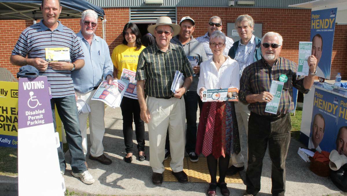 Handing out flyers for their respective parties today at Bega High School are (from left) Leo Hodgson, John Seckold, Amy Foster, Herb Parbery, Gavin Parbery, Vicki Younger, Keith Hughes, Graeme Bloomfield and Bob Porter.