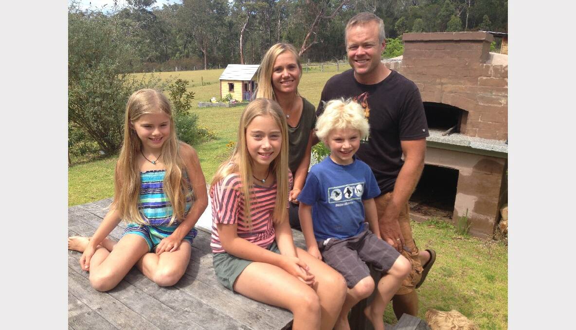 Jane Coppin with her family. Darcy (front centre), Brad, Ruby, eight, and Jesse, six.