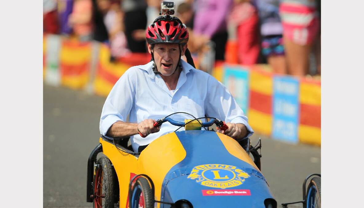 OAK FLATS: Member for Throsby took on the challenge at Sunday's Oak Flats Billy Cart Derby by taking part in a race - fitted with a Go   Pro.