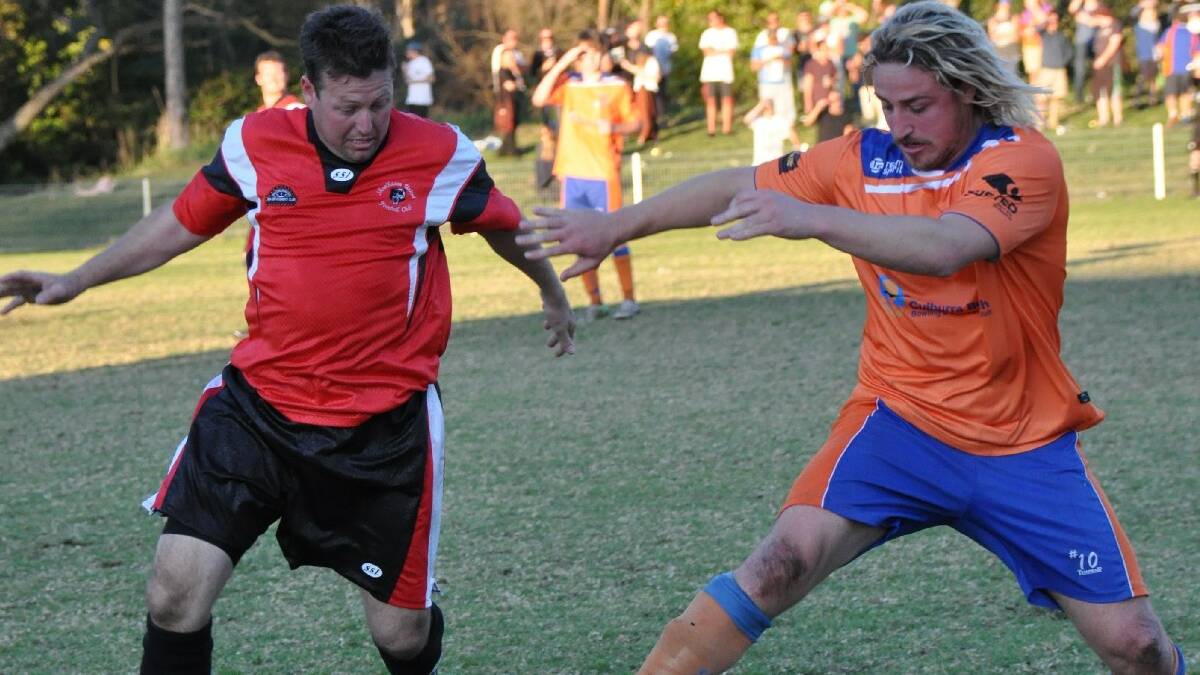 NOWRA: Shoalhaven United’s Warrick Schultz tries to stop Culburra’s danger man Corey Ryan in the major semi-final at Ison park on   Saturday.  Photo: GILLIAN LETT