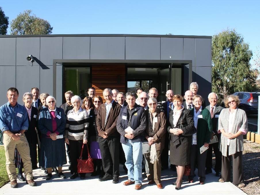 Officials and guests in the front of the entrance to the new multi-purpose facility at Pambula's Lumen Christi College that was opened on Tuesday, June 11.