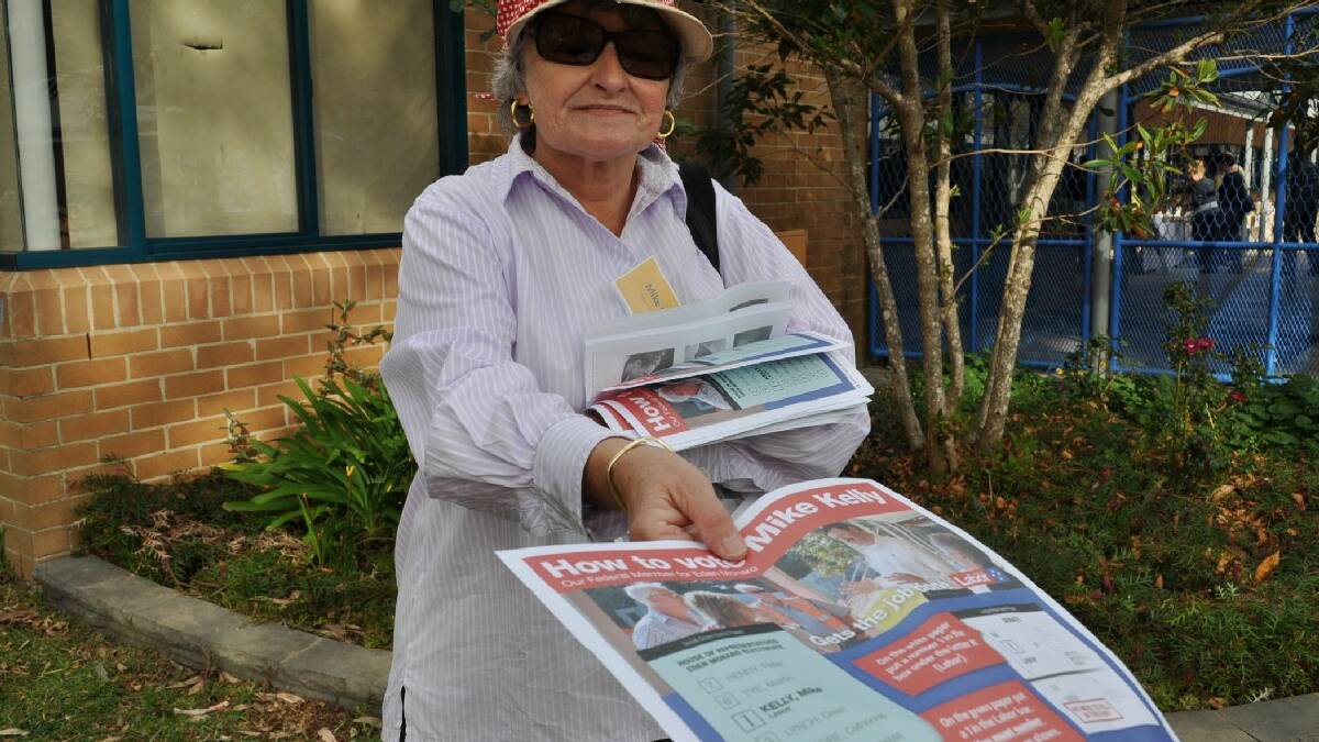Lorraine Maftoum handing out how to vote cards for Eden-Monaro MP Mike Kelly.