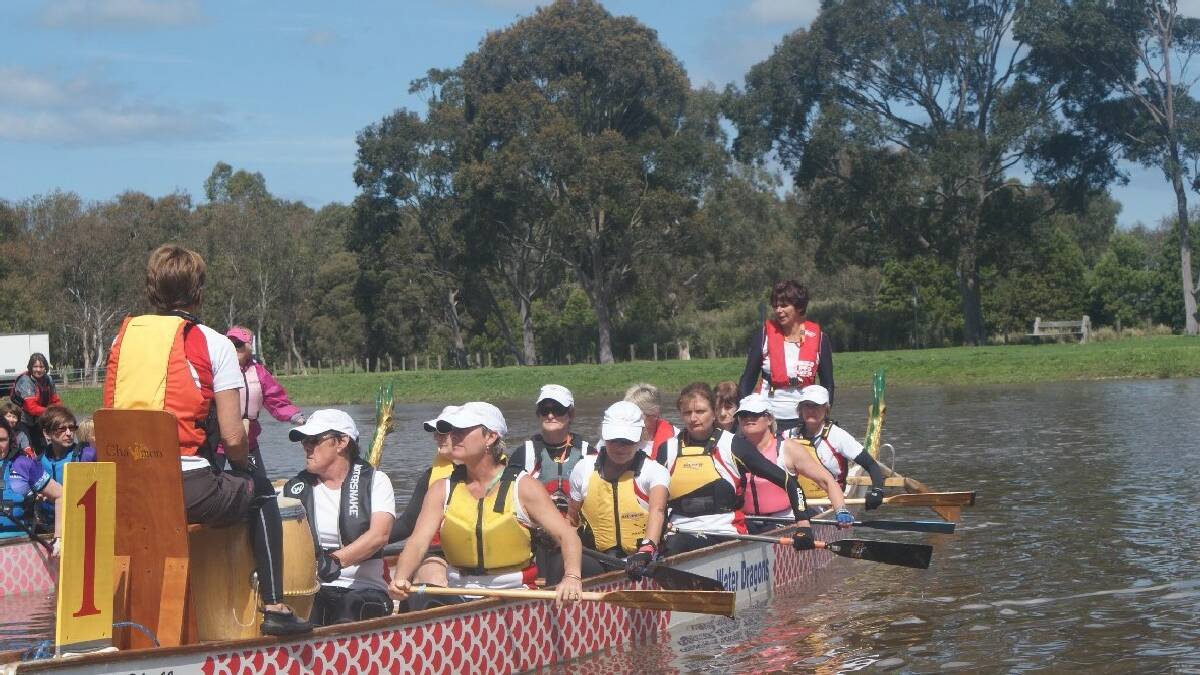 NAROOMA: Dragon boaters at the Australian Masters Games. The paddlers in the picture are from various clubs.   Narooma’s representative , Gilly Kearney, is in the seat second from the back.