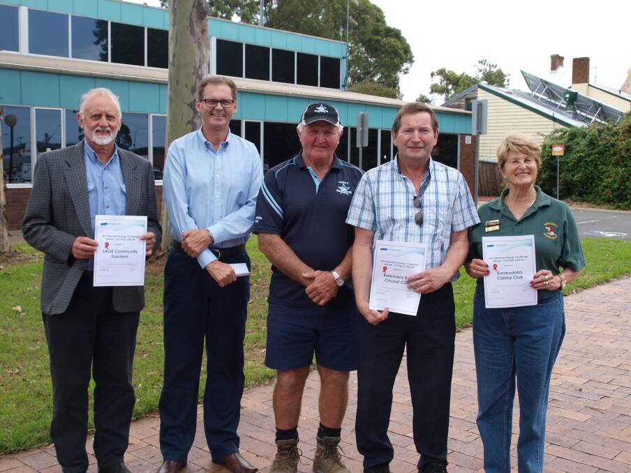 Eurobodalla Mayor Lindsay Brown (second from left) and Ack Weyman (centre) presented the prize money in Moruya today to the three winners of Council’s Ack Weyman Energy Challenge: L - R Stuart Whitelaw (representing 3rd prize winner, SAGE Community Gardens); John Condon (representing 1st prize winner, Batemans Bay Cricket Club) and Hilary Coulton (representing 2nd prize winner, Eurobodalla Canine Club).