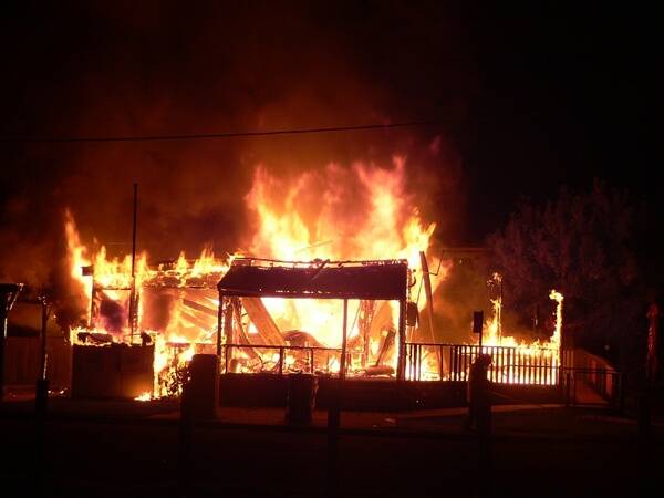 BURNT DOWN:  The Nelligen Store in flames in the early hours of Saturday morning.