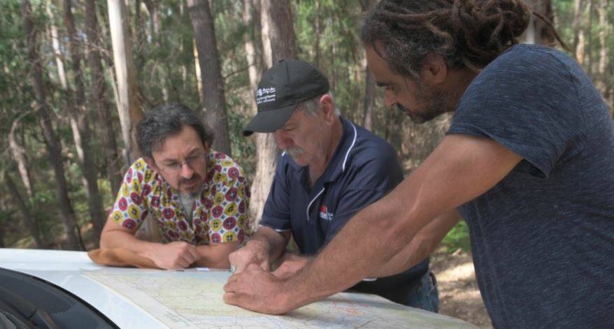 Historical anthropologist Dr Jason Gibson, Uncle Graham Moore and Dan Morgan discuss the Kuringal ceremony's location. Photo supplied