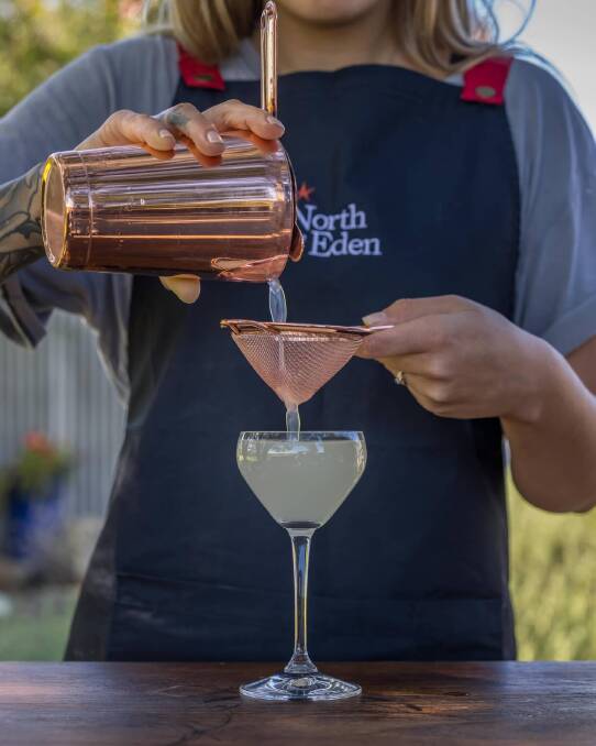 Apprentice distiller Ruby Jay makes one of the signature North of Eden cocktails. Photo: David Rogers