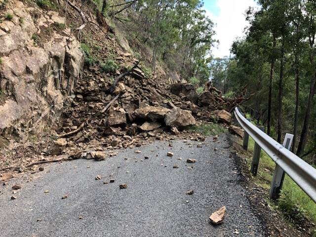 Rocks and debris cover a section of Araluen Road at Knowles Creek. Image: Supplied.