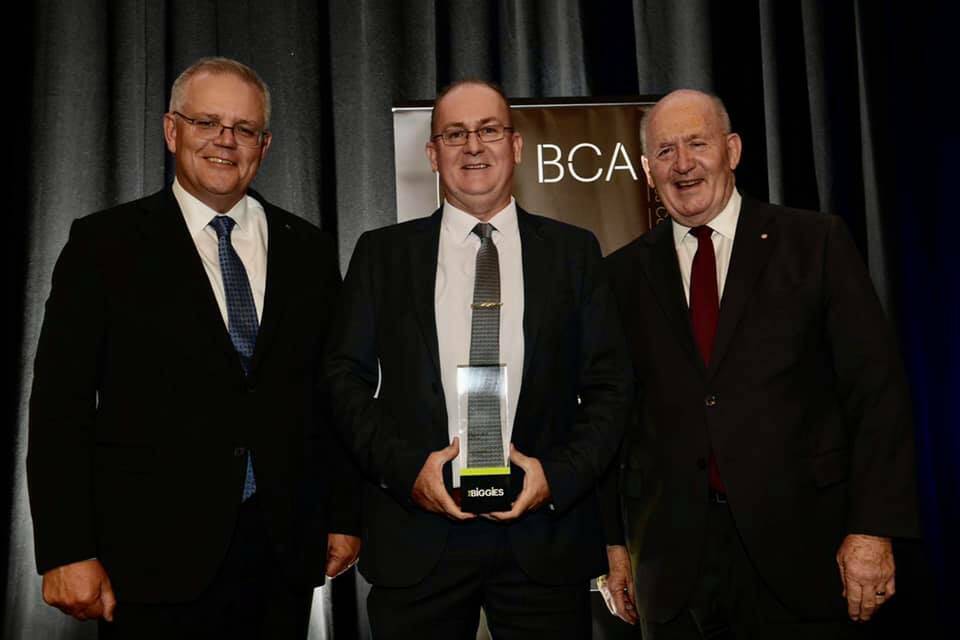 Proud win: John Appleby (centre) received the Big Heart award from Prime Minister Scott Morrison and former Governor-General of Australia Sir Peter Cosgrove. Photo: Supplied