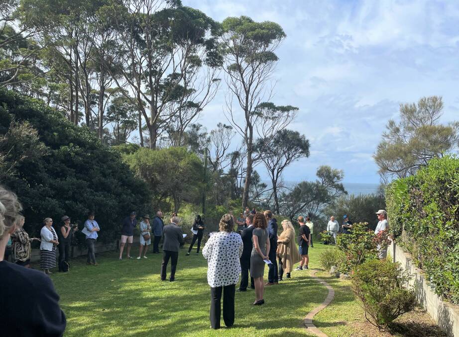 Around 50 people turned out to see who would snag the two bedroom, one bathroom clifftop home. Photo: Maeve Bannister 