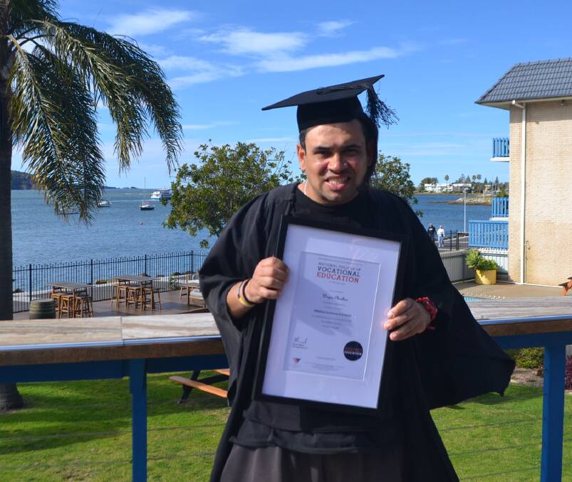 CON-GRAD-ULATIONS: Wayne Charlton graduates with a Certificate III in Retail from the National College of Vocational Education. Photo: Maeve Bannister 