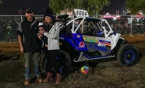 Matt Lavis with his wife Carly and their son Chase at the Finke Desert Race last month. Picture: supplied