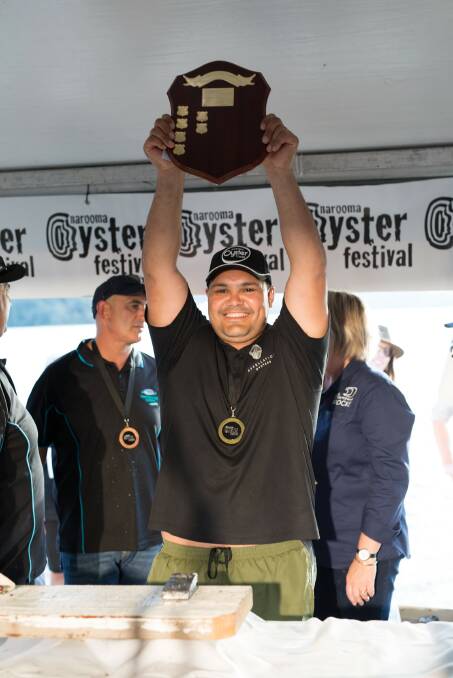 Gerard Dennis celebrates his shucking competition win at the Narooma Oyster Festival.