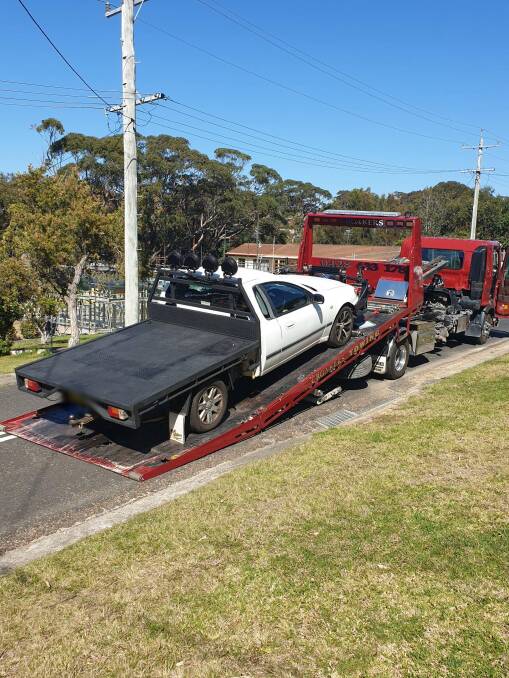 A white Ford utility that was seized by police after alleged burnout offences at Batemans Bay cemetery.