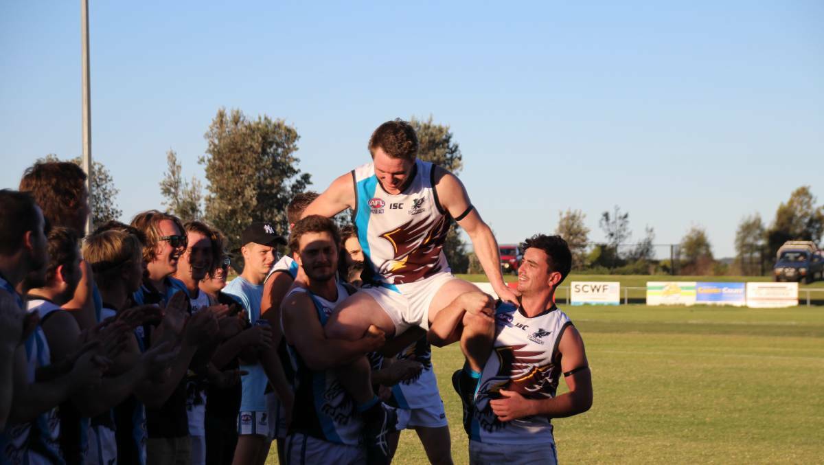 Sam Millynn is chaired off the ground after his 200th first-grade game with the Batemans Bay Seahawks in 2018.