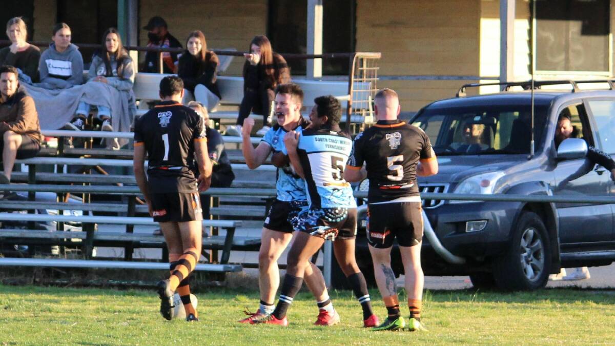 Moruya's Jack Grant celebrates one of his three tries with Yuin Campbell. Picture: Moruya Sharks