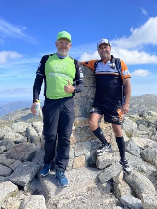 Dean Gillard (left) and Brenden Fernly at the summit of Mt Kosciuszko on Saturday, March 12.