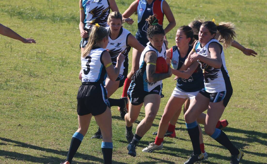 Seahawks co-captain Ali Ryan (shown with the ball) finished in equal third place in the best-and-fairest count.
