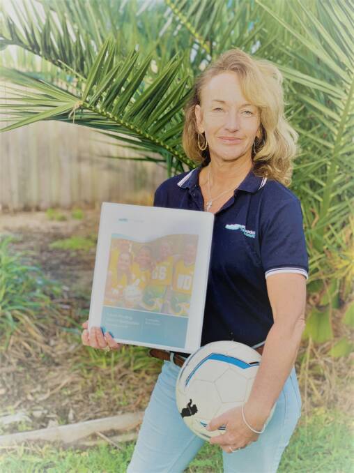 Eurobodalla Shire Council's Recreation Development Coordinator, Tina Smith, holds the new resource kit they have developed for sporting clubs in the region.