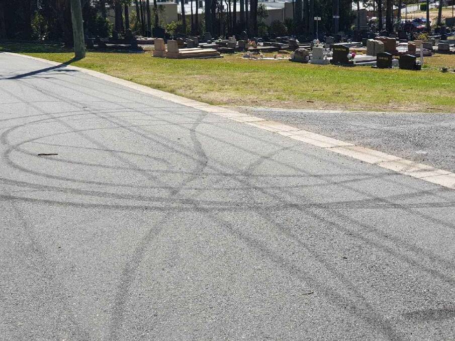 Tyre marks on the ground near Batemans Bay Cemetery. Four men were charged over their alleged involvement in the incident that caused the marks.