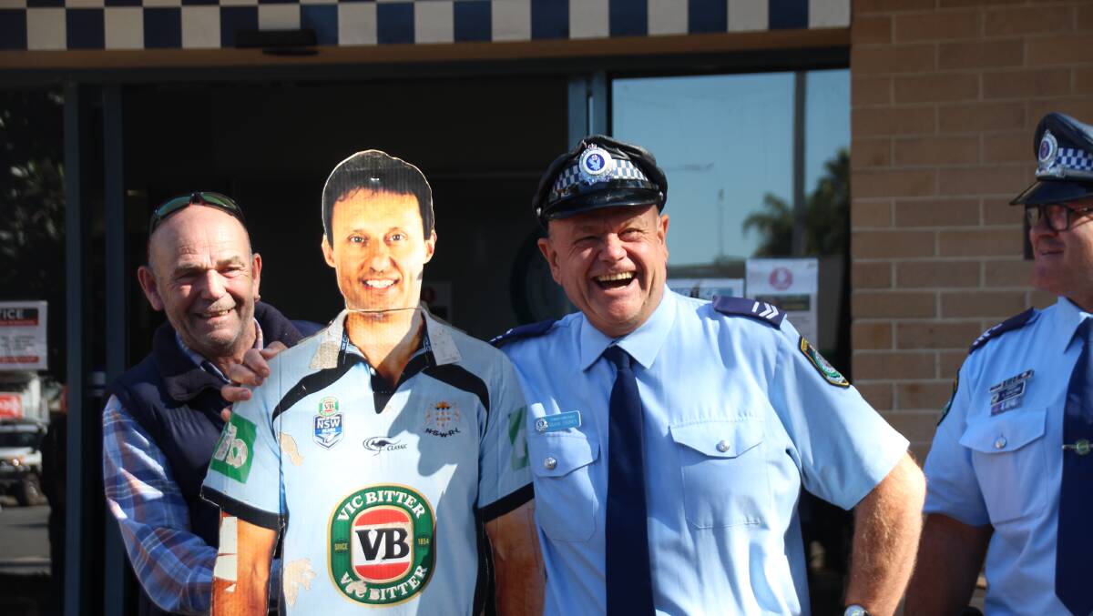 Senior Constable Mark Dawes with the cut-out of Laurie Daley that made an appearance in his guard of honour.