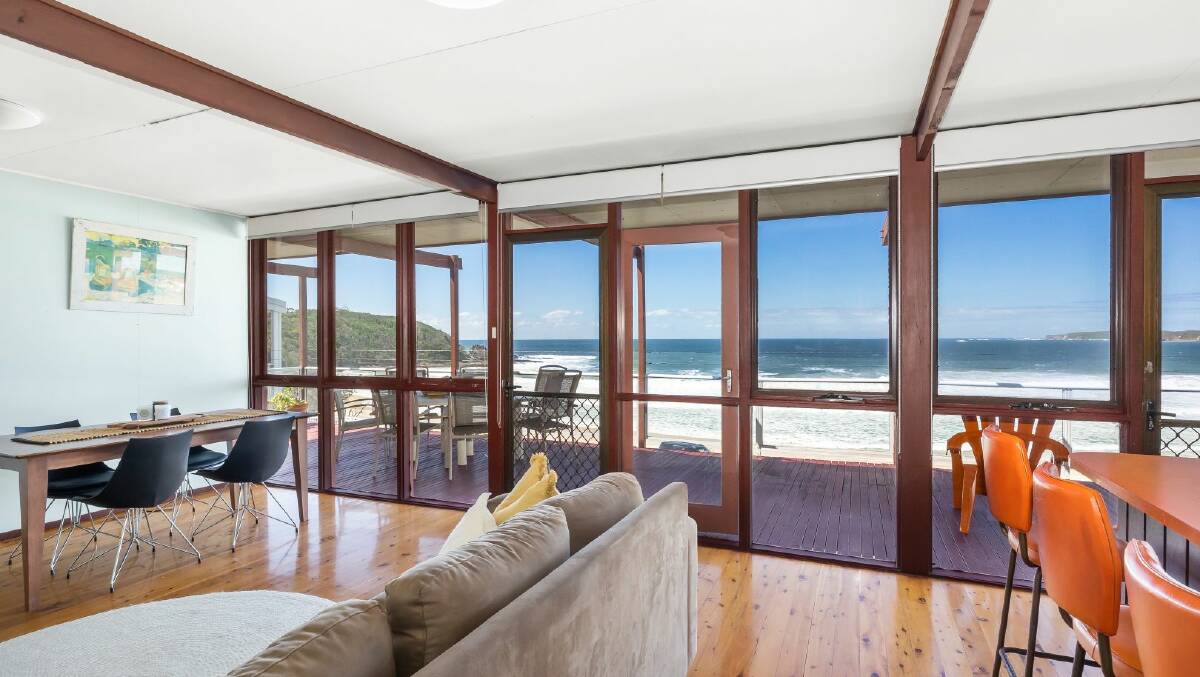 The main living area leads out onto the front verandah directly overlooking the ocean. Picture: Raine and Horne Mollymook/Milton