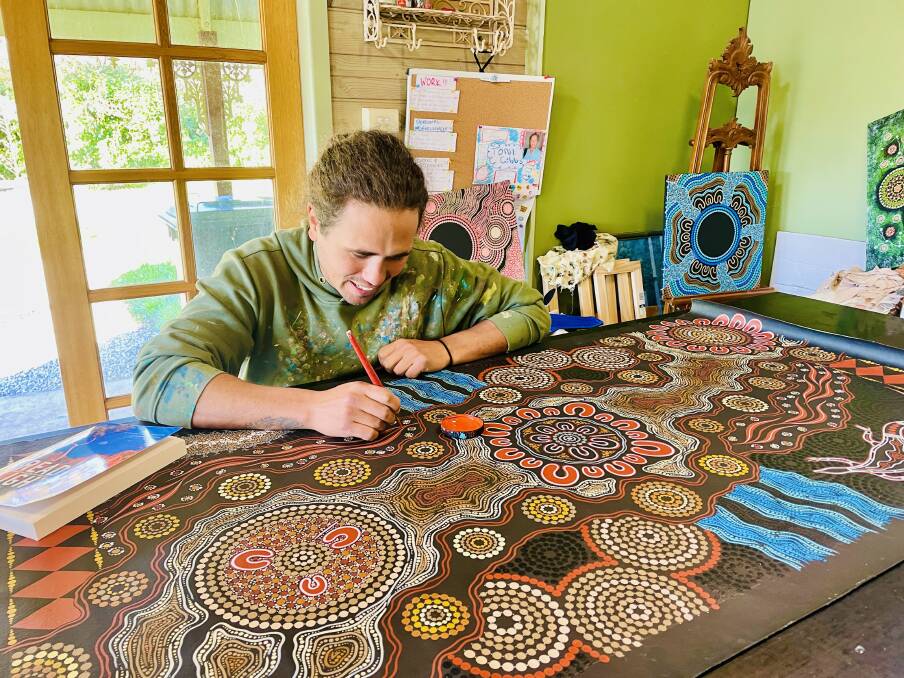 ARTISTIC SHINE: Sandon Gibbs-O'Neill, founder of Burruguu Art, finds his inspiration from his Aboriginal culture, his late grandfather Tex Skuthorpe and his partner with their two daughters. Photo: EMILY GOBOURG.