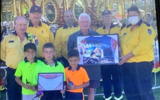 Elwin Bell Snr receiving a certificate of appreciation from Surf Beach RFB and Batemans Bay SES
Source: Surf Beach RFB