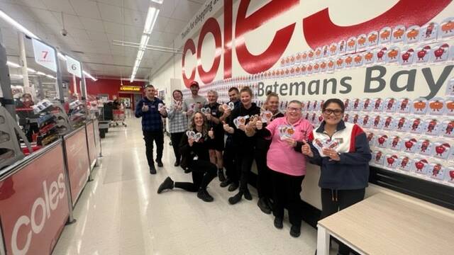 Coles Batemans Bay staff team celebrating the generosity of the community in raising more than $7500 for SecondBite. Picture: supplied