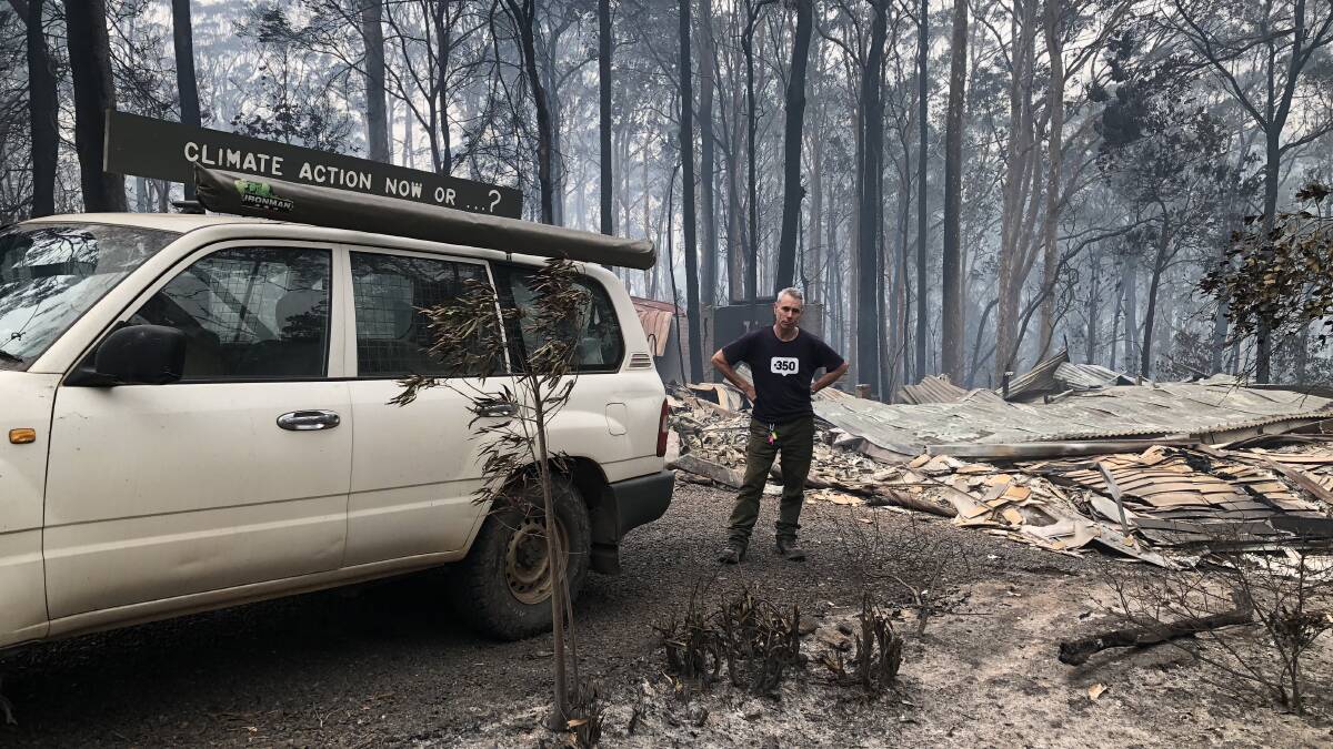 Rosedale resident Jack Egan and the remains of his house after the Black Summer Bushfires
