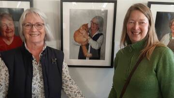 Local volunteer Yvonne with her portrait in the exhibition, and the EPC member Beth, who took the shot.
Photograph: Supplied